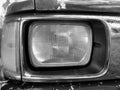 Front details on the headlights of the old car, with focus headlight close-up vintage concept