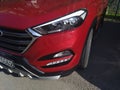 Front Details of Red Hyundai Tucson in a parking lot