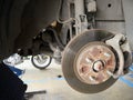 Front disk brake system of the car after remove the tire for repair and maintenance at car service center.