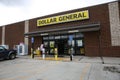 Front of the Dollar General store with a customer pushing a shopping cart Royalty Free Stock Photo