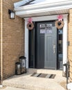 Detail of a black front door on a brick home. Royalty Free Stock Photo