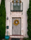 Front door of a Californian home with a wreath