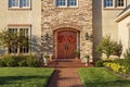 Front door, horizontal view of front door with beautiful landscaping Royalty Free Stock Photo