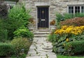 Front door of house with flagstone path