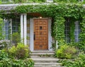 Front door of house surrounded by ivy Royalty Free Stock Photo