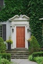 front door of house surrounded by ivy Royalty Free Stock Photo