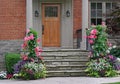 front door of house, surrounded by summer flowers