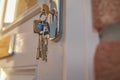 Front door keys in the keyhole Royalty Free Stock Photo