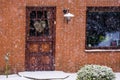 Front door of a modern dutch home during winter season, snowy weather in the Netherlands