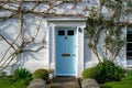 the front door of an old english cottage with ivy growing around the door Royalty Free Stock Photo