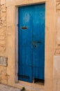 Front door of old house with blue weathered planks Royalty Free Stock Photo