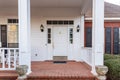 Beautiful white Front door and porch of a residential home Royalty Free Stock Photo