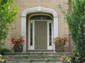 Front door with sidelights and transom window Royalty Free Stock Photo