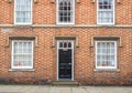 Front door and windows of English cottage Royalty Free Stock Photo