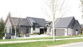 High-end Modern Designer Home Construction in Canada with Double Car Garage Front Elevation Royalty Free Stock Photo