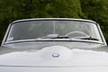 Front emblem of a Mercedes-Benz 190 SL cabrio german oldtimer car at the Cars & Coffee event at the Mercedes-Benz Museum Royalty Free Stock Photo