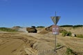 Front end loader carries sand in a mining area