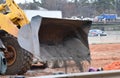 Front end loader dumps a load of gravel