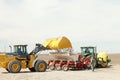 Front end loader filling a planter with bulk potato seed.