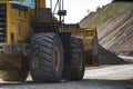 A front end loader machine tipping sand in a Royalty Free Stock Photo