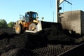 Front End Loader Moving Piles of Coal