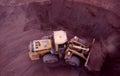 Front end loader working gold ore stockpile