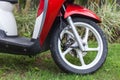 Front end of a red scooter. Royalty Free Stock Photo