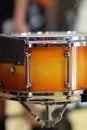Front ensemble percussion rack orange snare drum