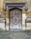 Front entrance of a building adorned with exquisite wooden doors and intricate metalwork