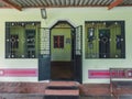 Front entrance of house with big gates and windows at Konkan.