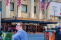 Front entrance and marquee of The Hotel Pennsylvania in Manhattan, New York City with the doorman in front and pedestrians passing Royalty Free Stock Photo