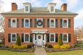 historic professional building shutters windows decorated with Christmas wreaths Royalty Free Stock Photo