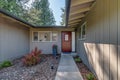 Front facade exterior real estate photo with cement path and wood chip garden