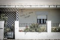 Front facade of a residential house identified with the phrase, "Vivenda o Nosso Sacrificio"