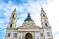 Front facade of St. Stephen`s Basilica in Budapest, Hungary on with blue sky and clouds above. Roman Catholic basilica built in Royalty Free Stock Photo