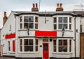 Front facade of a typical English pub on a cloudy day Royalty Free Stock Photo