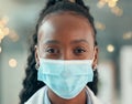 Front face of doctor wearing a covid mask. African american doctor closeup in the office. Portrait of african american