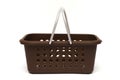 A brown plastic basket with metallic silver painted carrying handles