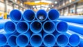 Front View of Stacked Blue PVC Plastic Pipes in an Industrial Setting image photo Royalty Free Stock Photo