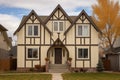 front gable of a cream-colored tudor style home