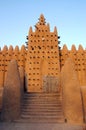 Front gate and minaret on Djenne mosque Royalty Free Stock Photo