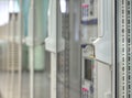 Front glass doors on electrical control cubicles and key in control room on electrical substation