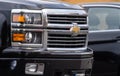 Front grille of a black 2016 Chevrolet Silverado..