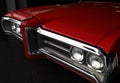 Front grille of red vintage car