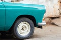 Front Half of a Vintage Car parked outside a repair workshop or Royalty Free Stock Photo