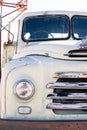 Front headlamp and grill of an old white bedford truck