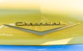 Front hood emblem of a yellow Chevrolet Bel Air