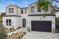 Front of house with driveway, garage, and paved pathway Royalty Free Stock Photo