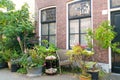 Front of house with plants in pots in street of old town of Scheveningen, Netherlands Royalty Free Stock Photo