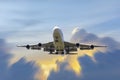 Front image commercial passenger aircraft or cargo transportation airplane fly to sky with sunshine and cloudy background effect Royalty Free Stock Photo